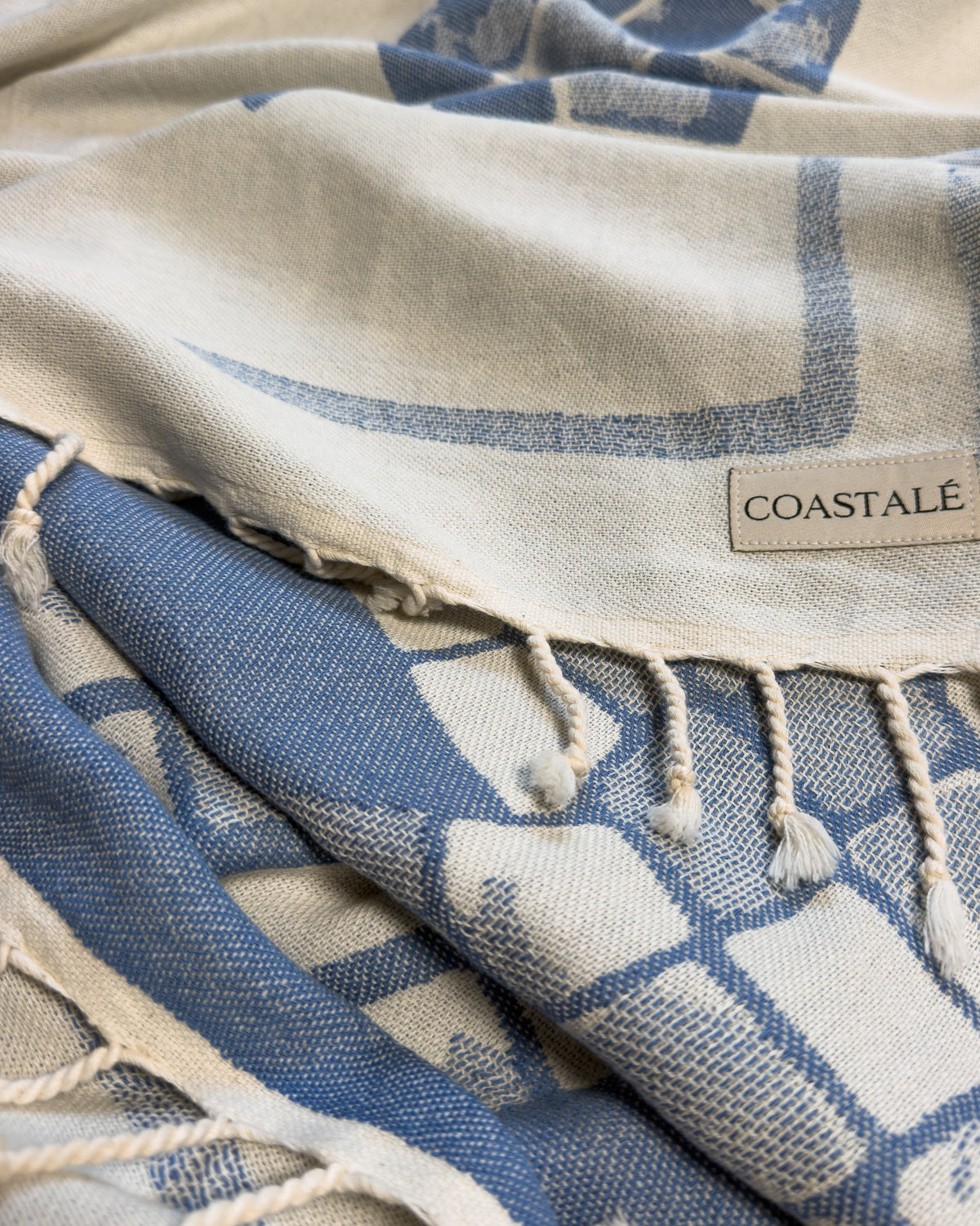 COASTALÉ label on the Glide organic Turkish cotton beach towel