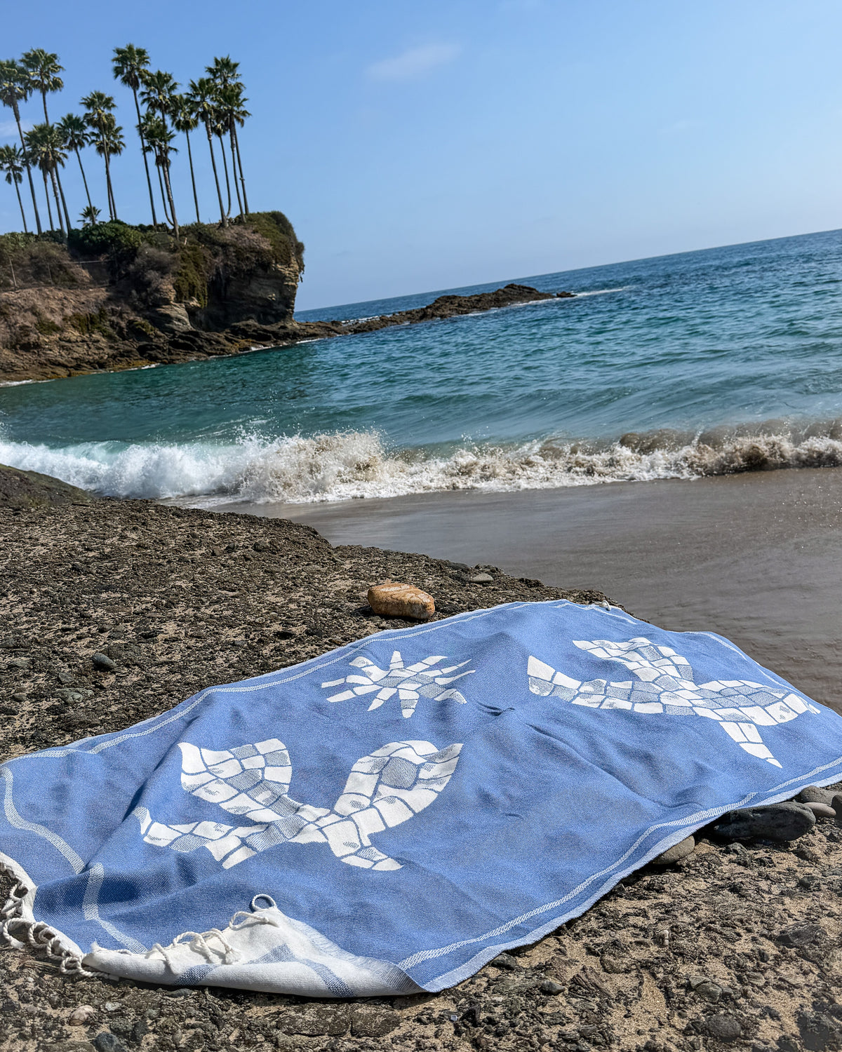 Lifestyle back view of the Glide organic Turkish cotton beach towel