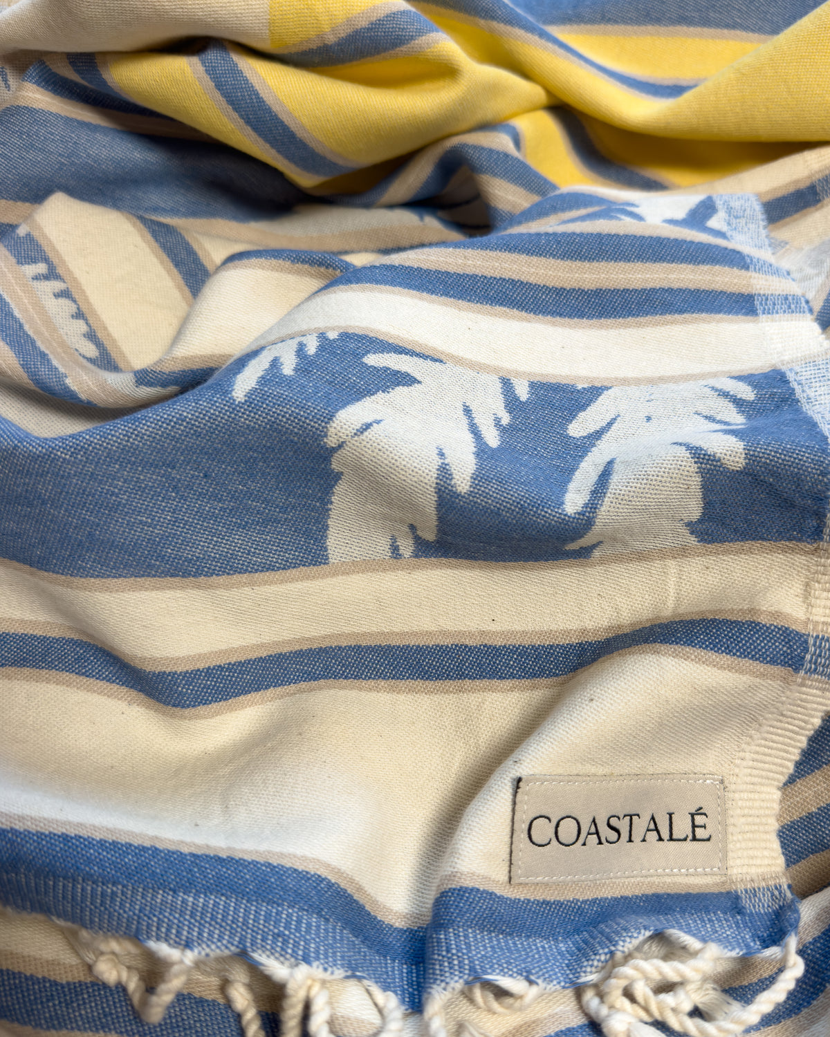 Front view of the twisted Horizon organic Turkish cotton beach towel with California inspired jacquard design