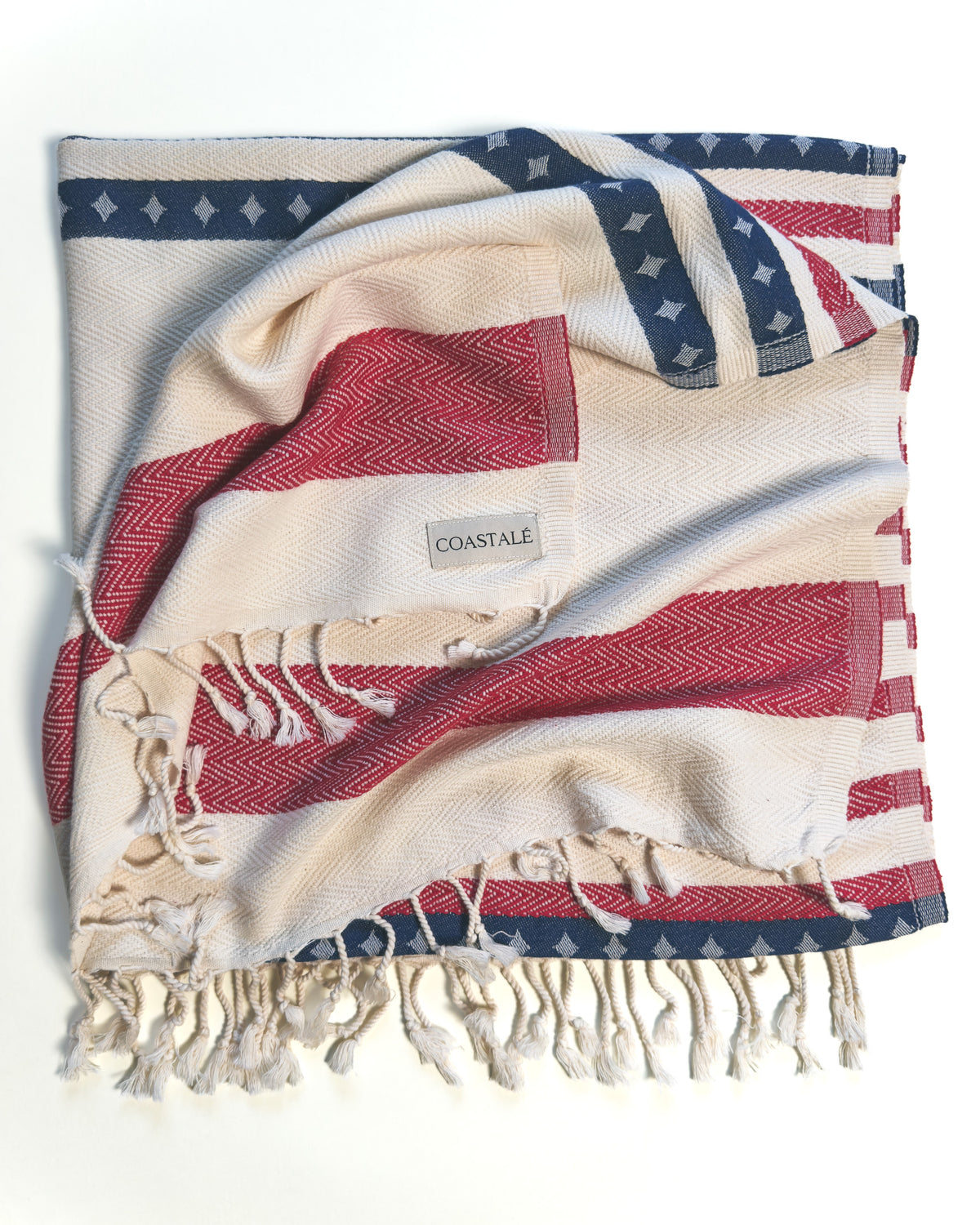 Folded and twisted Old Glory organic Turkish cotton beach towel. 4th July, American Flag design.