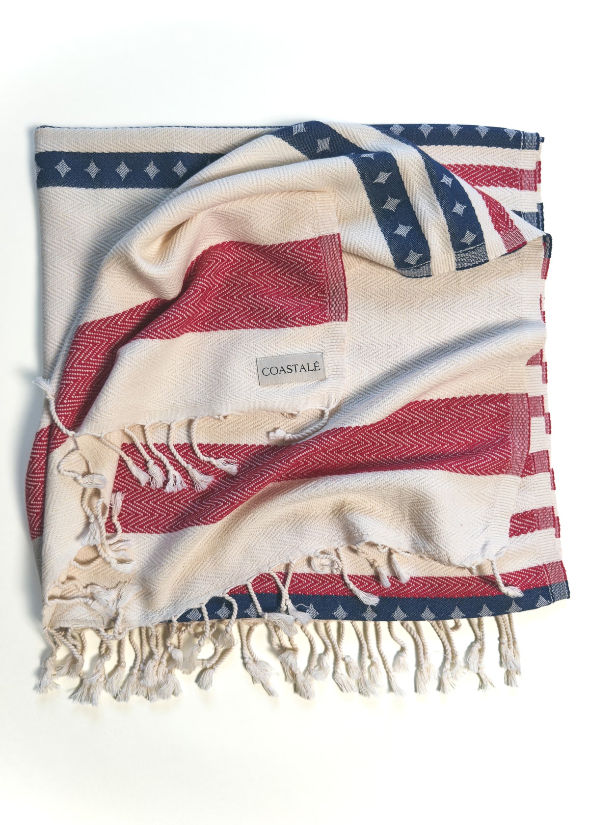 Folded and twisted Old Glory organic Turkish cotton beach towel. 4th July, American Flag design.