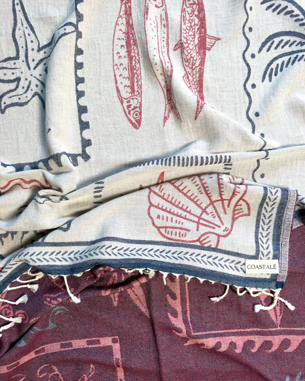 Close-up of the Shore Treasures navy organic Turkish cotton beach towel