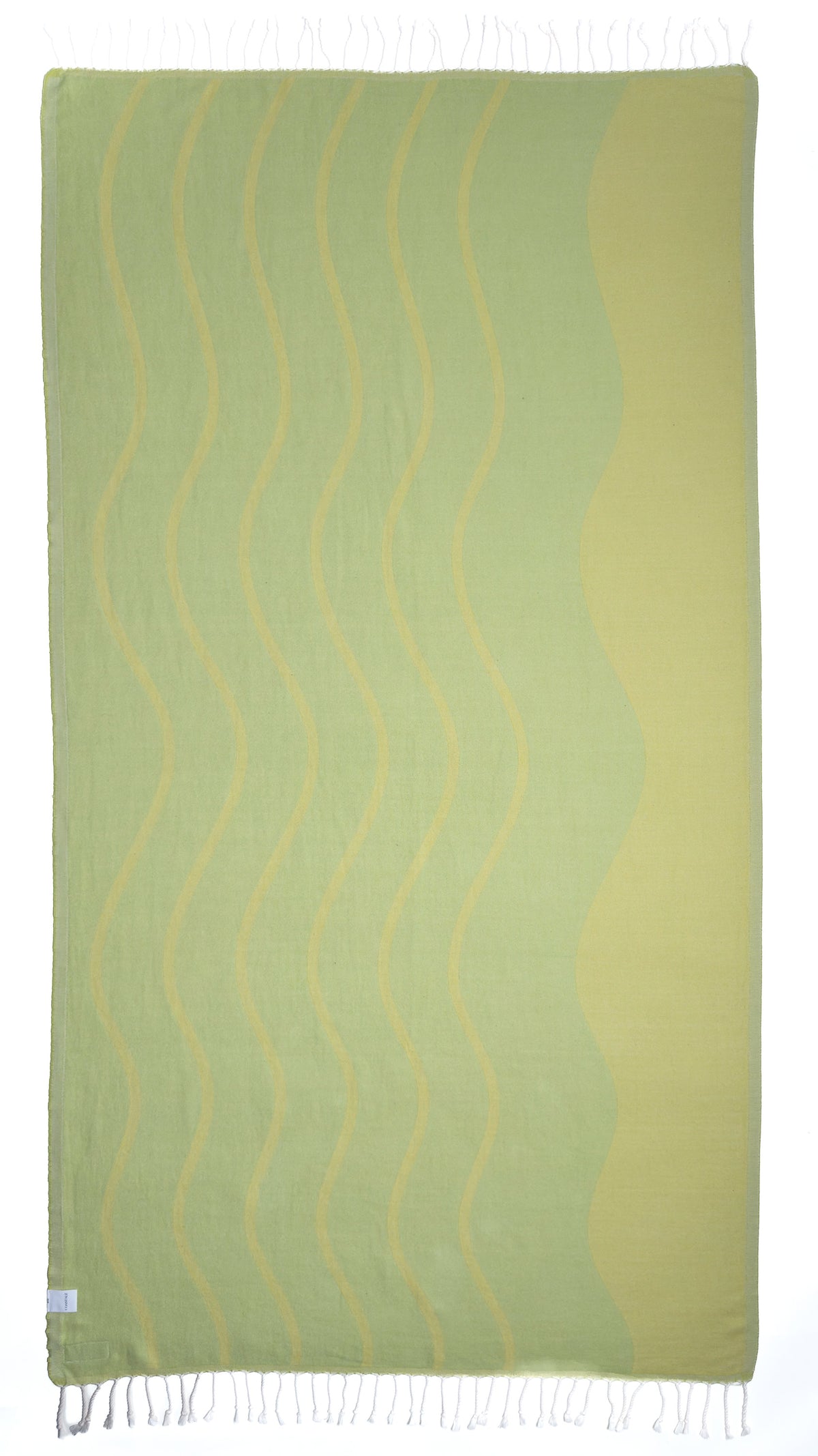 Back view of the reversible Swell lemon organic Turkish cotton beach towel
