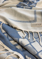 COASTALÉ label on the Glide organic Turkish cotton beach towel