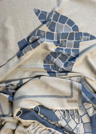 Front view of the twisted Glide organic Turkish cotton beach towel with California inspired jacquard design
