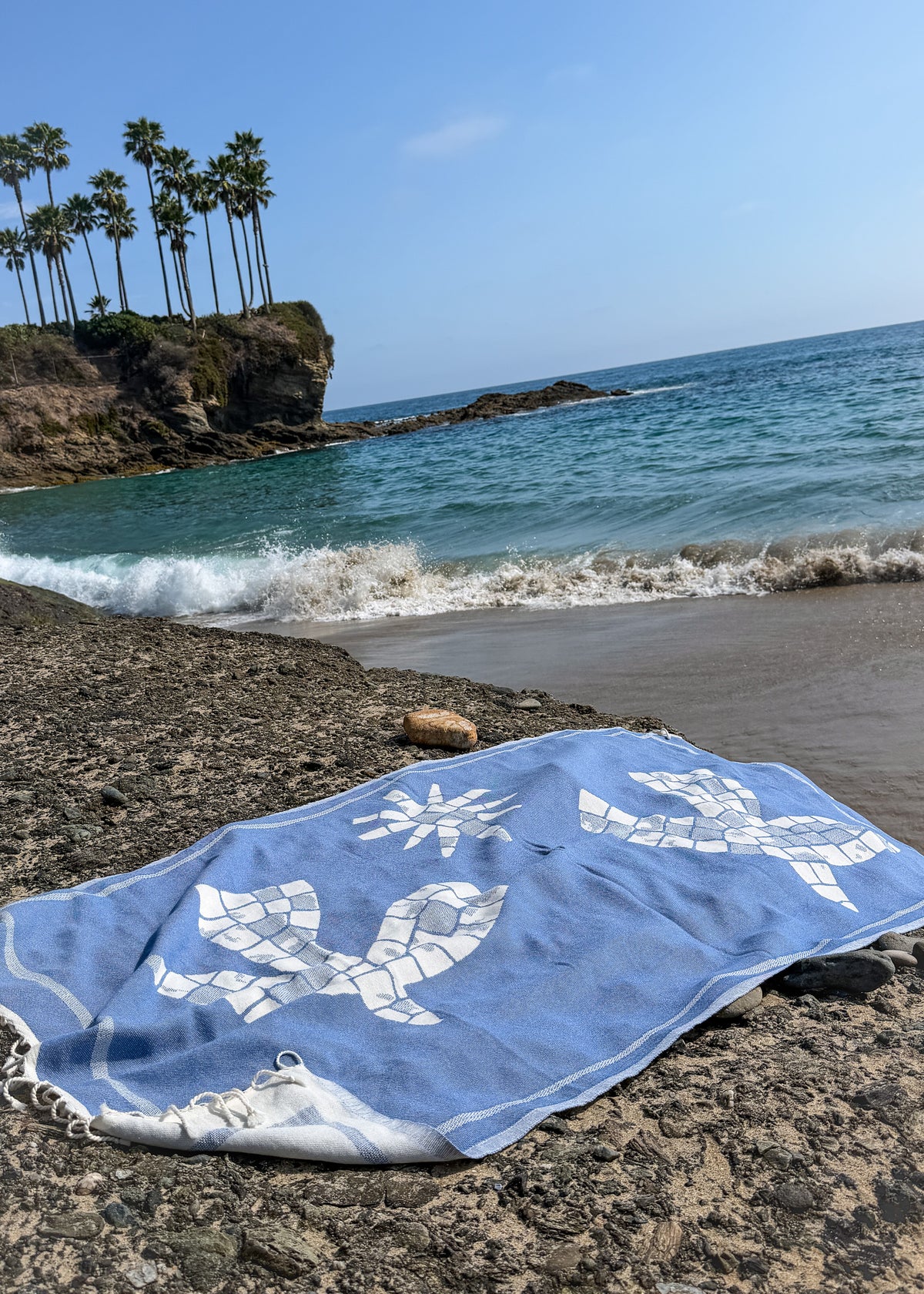 Lifestyle back view of the Glide organic Turkish cotton beach towel