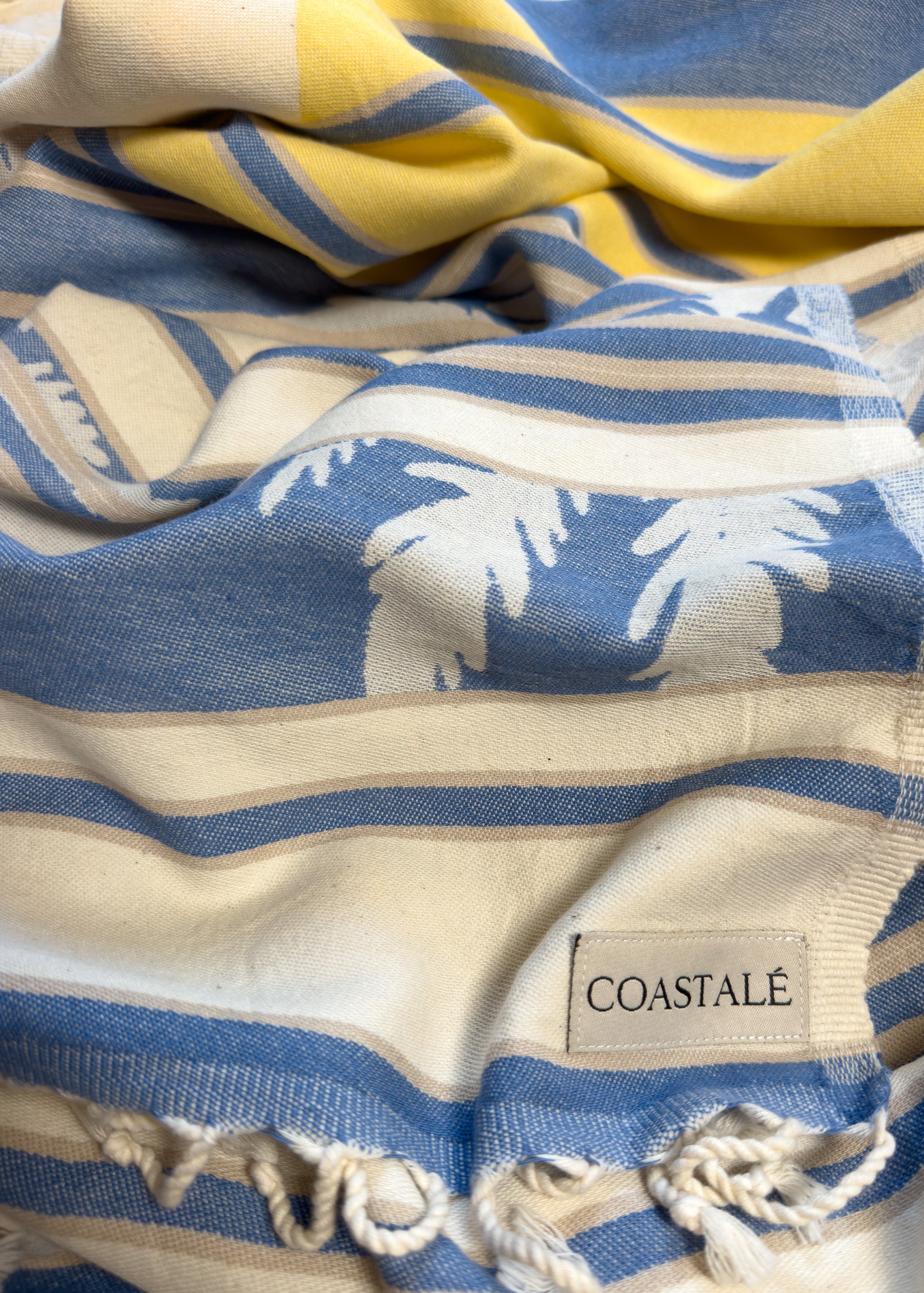Front view of the twisted Horizon organic Turkish cotton beach towel with California inspired jacquard design