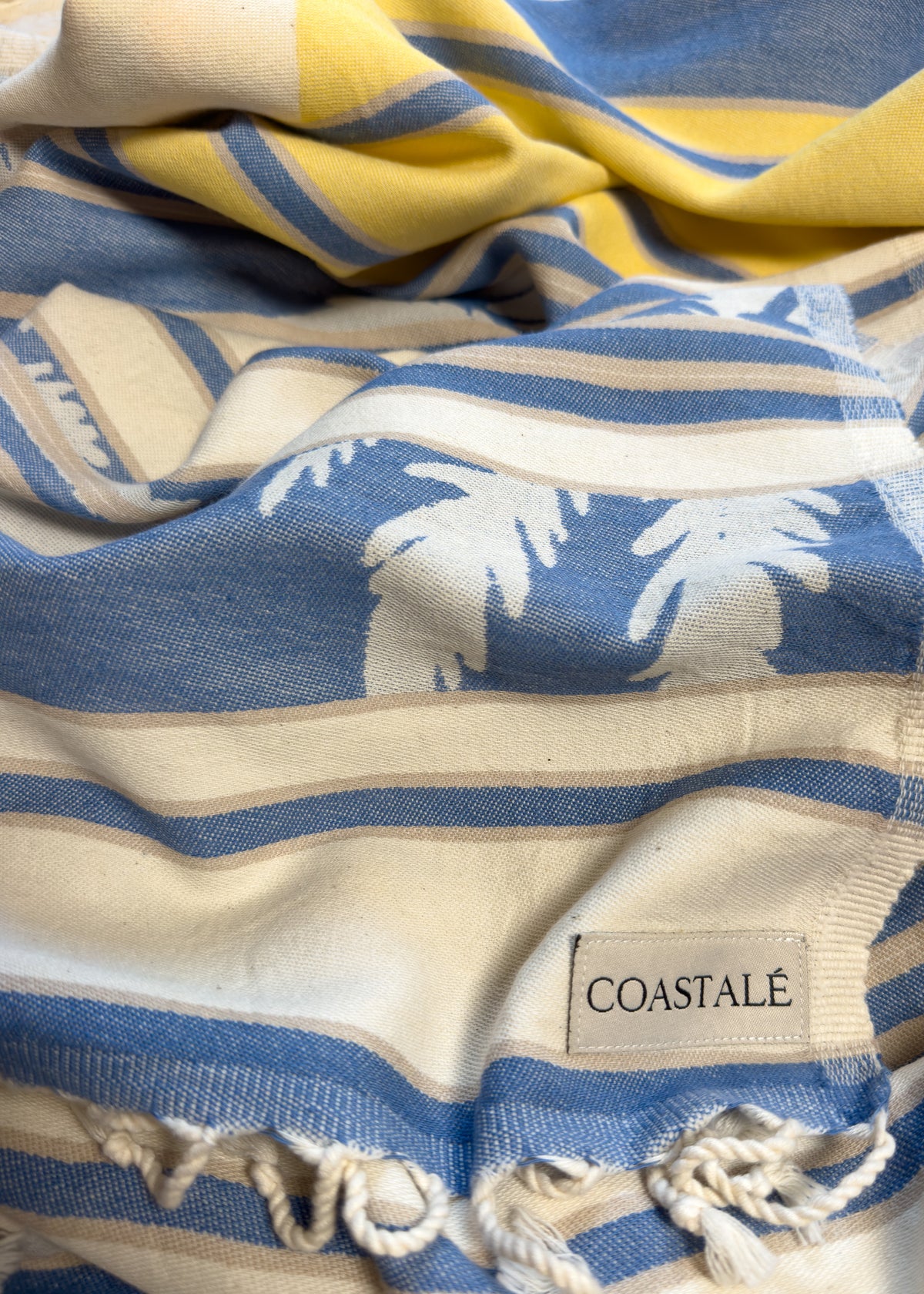 Front view of the twisted Horizon organic Turkish cotton beach towel with California inspired jacquard design
