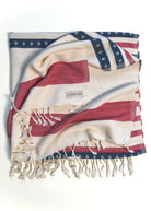 Folded and twisted Old Glory organic Turkish cotton beach towel. 4th July, American Flag design.

