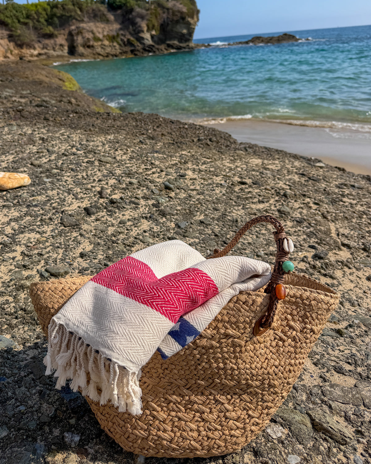 Lifestyle view of the Old Glory organic Turkish cotton beach towel.