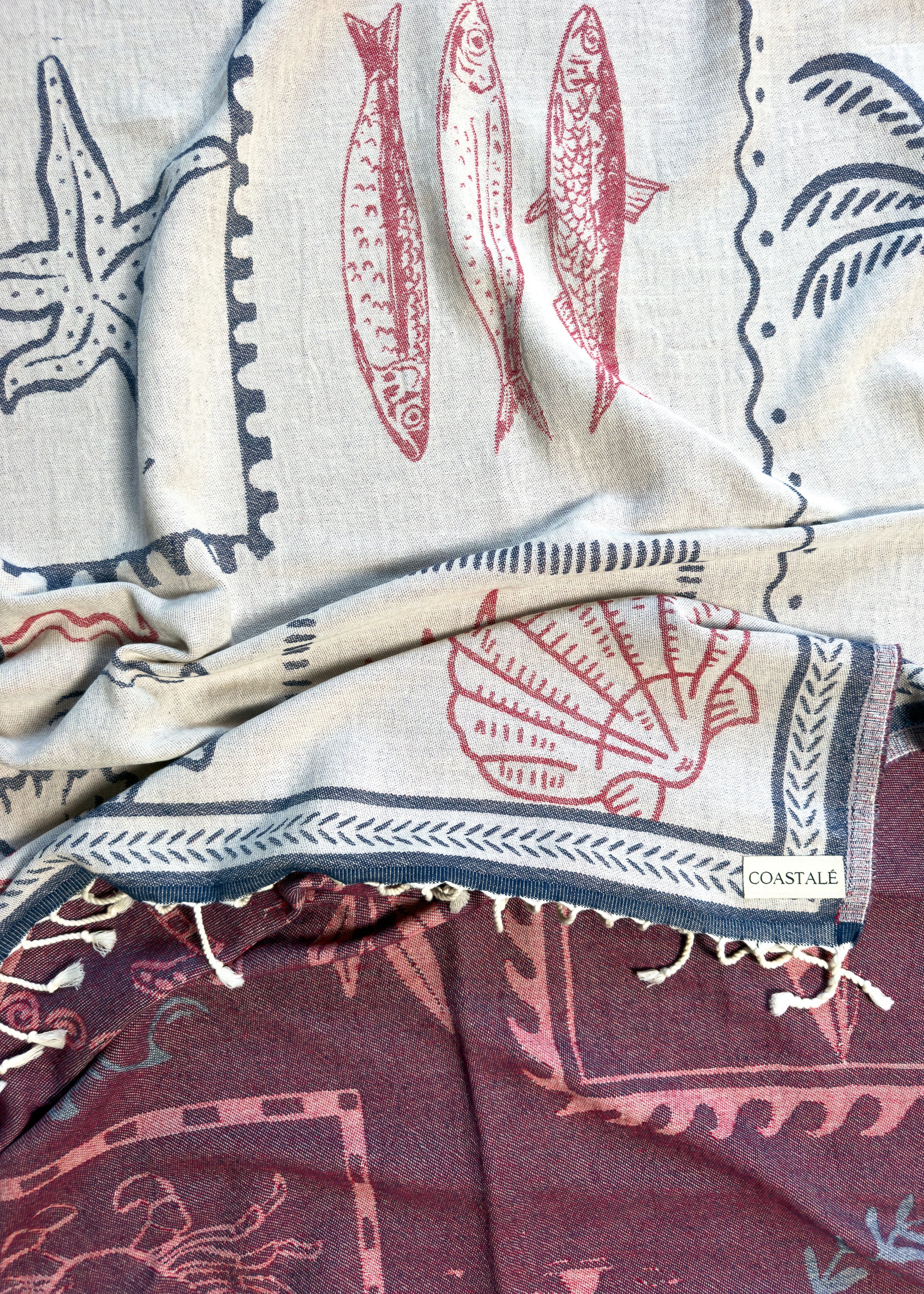 Close-up of the Shore Treasures navy organic Turkish cotton beach towel