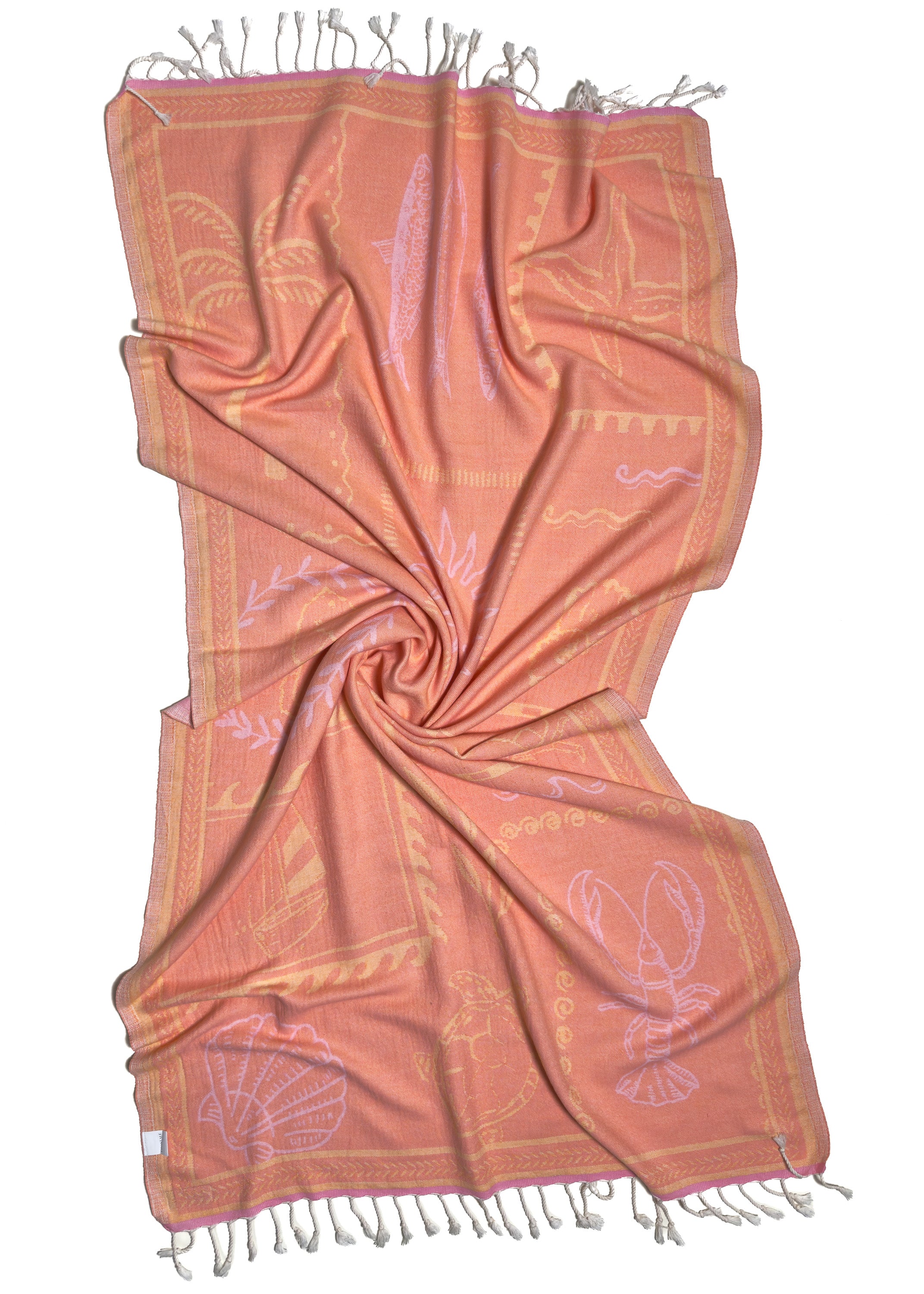 Back view of the twisted Shore Treasures pink organic Turkish cotton beach towel with California inspired jacquard design