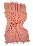 Back view of the twisted Shore Treasures pink organic Turkish cotton beach towel with California inspired jacquard design