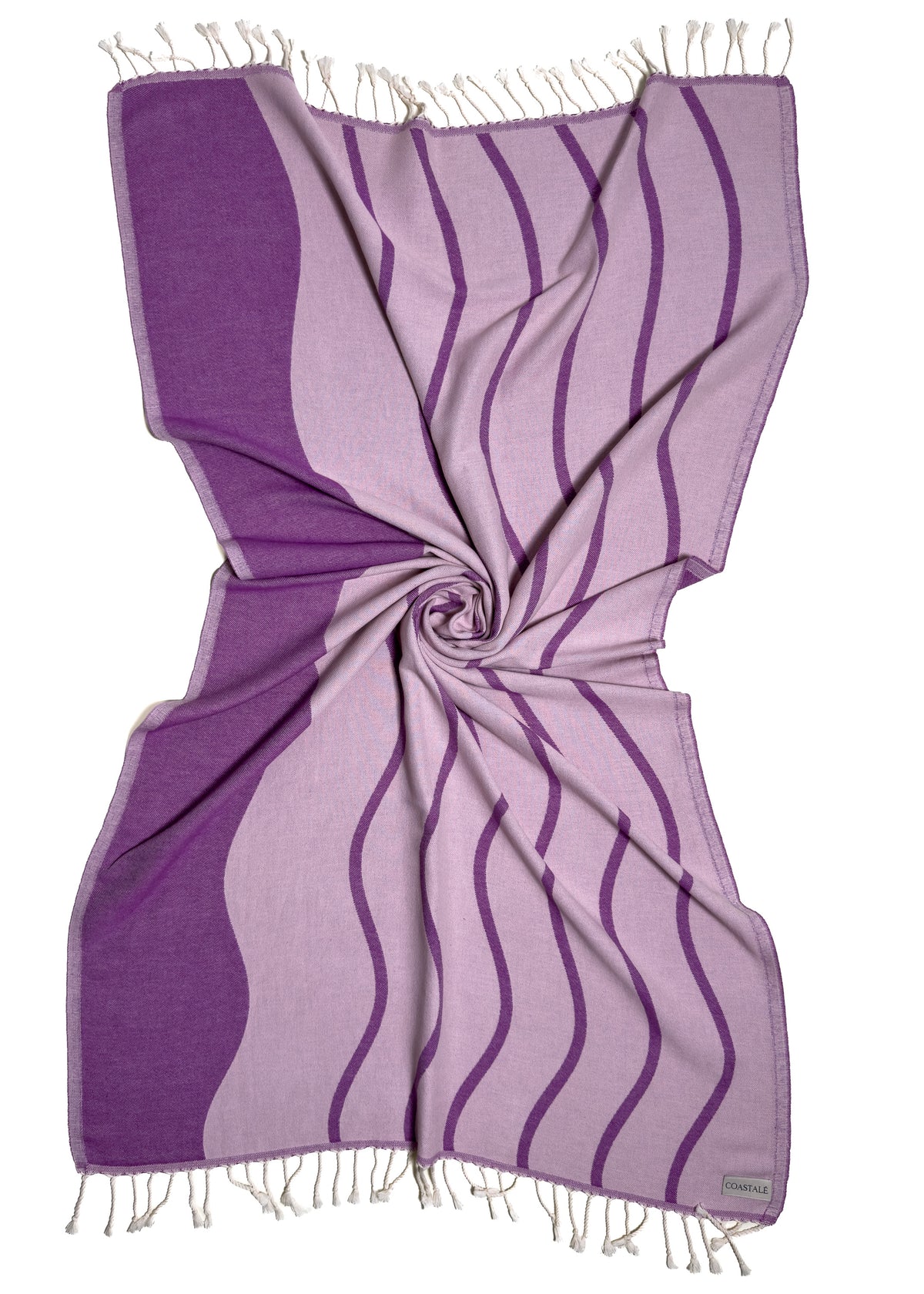 Front view of the twisted Swell purple organic Turkish cotton beach towel with California inspired jacquard design