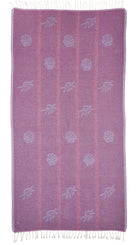 Back view of the reversible Tideline organic Turkish cotton beach towel